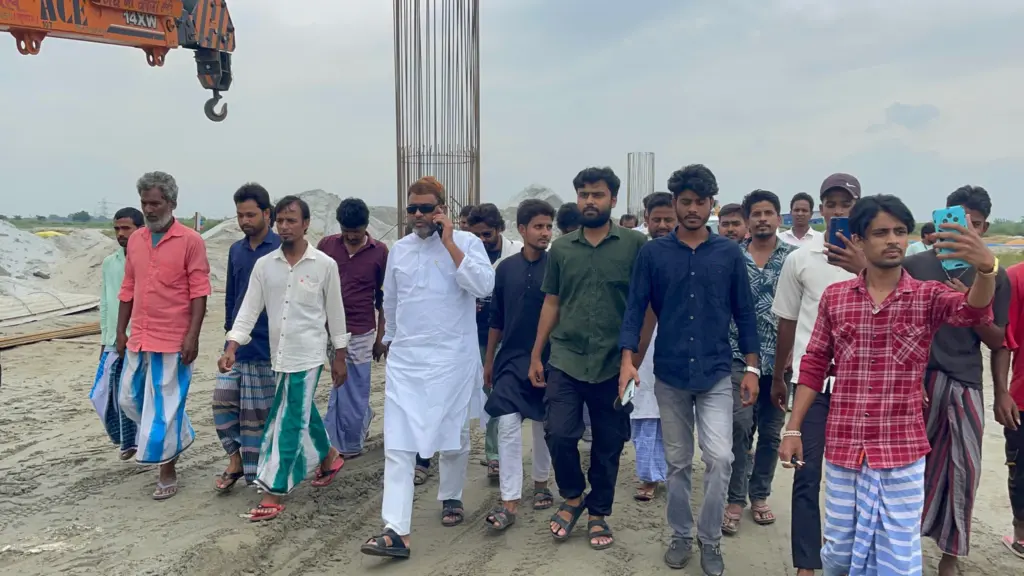 Aktarul Iman visits construction site to review ongoing work.