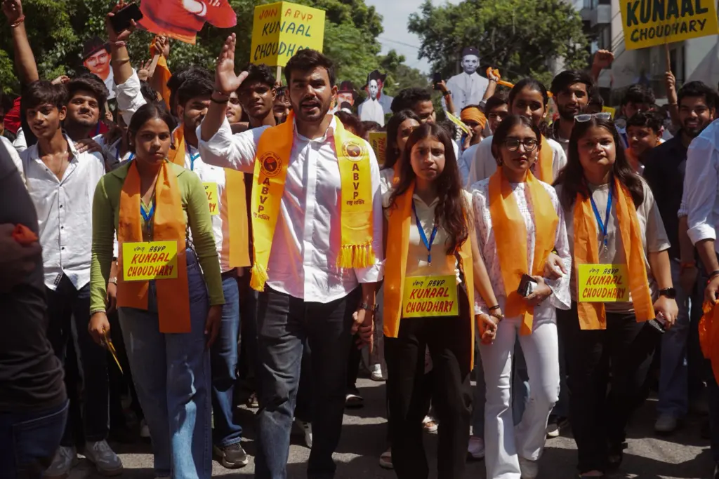 Kunal Choudhary standing with students to support their issues.