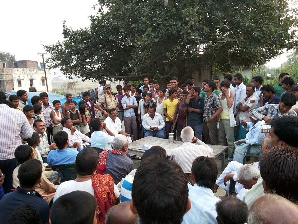 Rampravesh Rai interacting with villagers during a community meeting