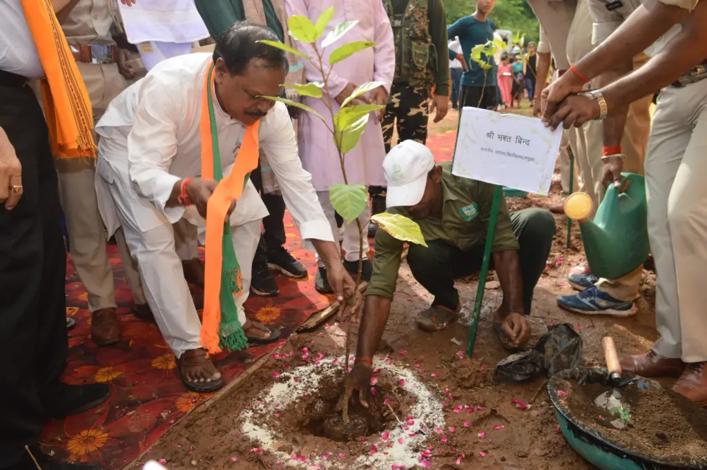Bharat Bind planting a tree.