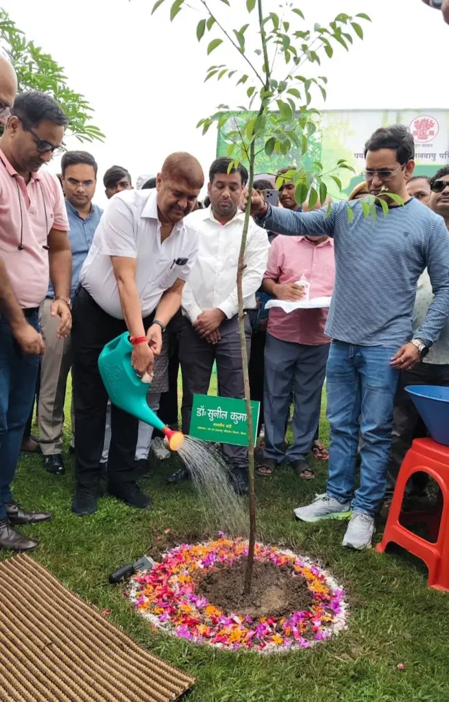 Dr. Sunil Kumar planting a tree.