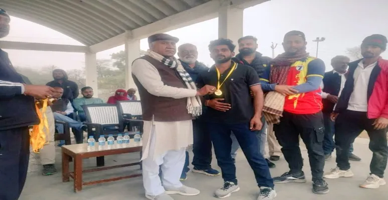 Om Prakash Yadav giving awards.