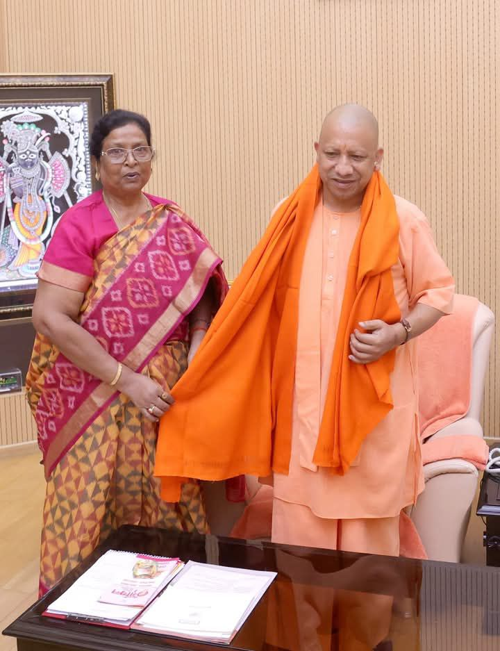 Renu Devi is with Uttar Pradesh Chief Minister Yogi Adityanath.