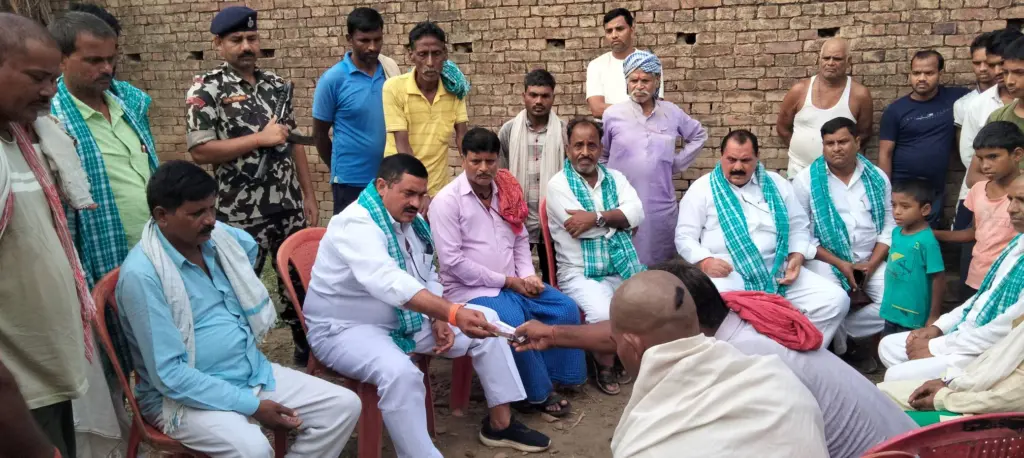 Shambhu Nath Singh Yadav meeting with people and helping them.